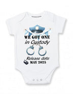 Daiichiban Designs Police Pregnancy Announcement Baby Bodysuit – “We Got One in Custody” with Custom Date